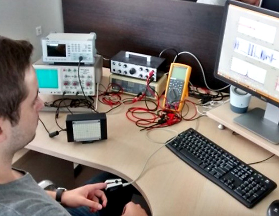 NOVELIC engineer working on signal processing using own NOVELIC hardware